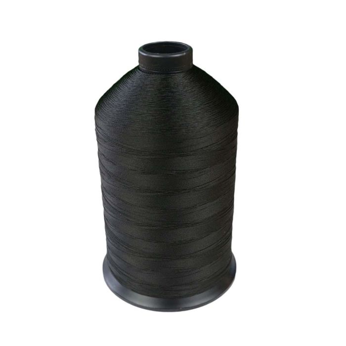 Premium Photo  Spool with black thread and needle and thread